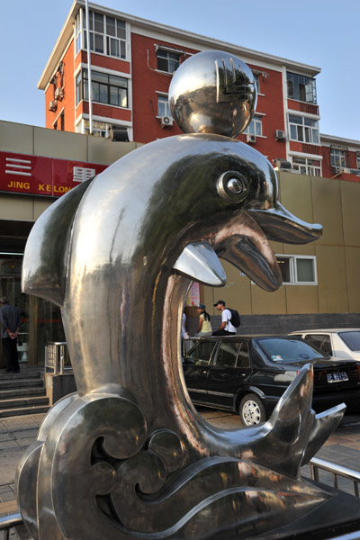 Sculpture of a dolphin with a ball, Beijing
