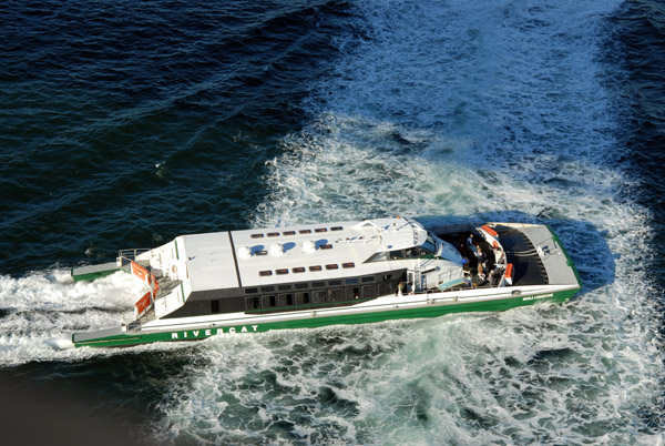 Sydney Rivercat passes beneath the Sydney Harbour Bridge