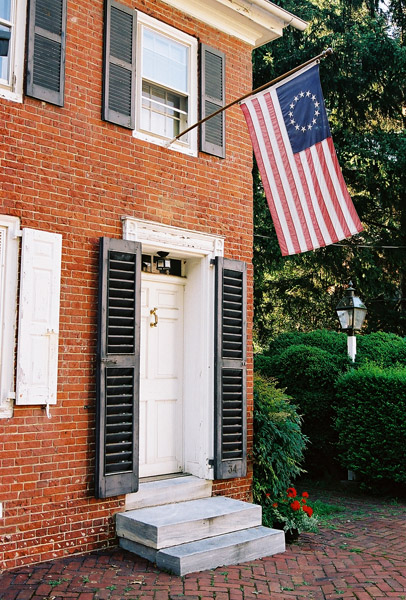 Old brick house in New Castle flying the Betsy Ross Flag