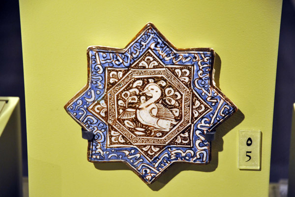 Lustre and cobalt-blue star tile, 14th C. Iran