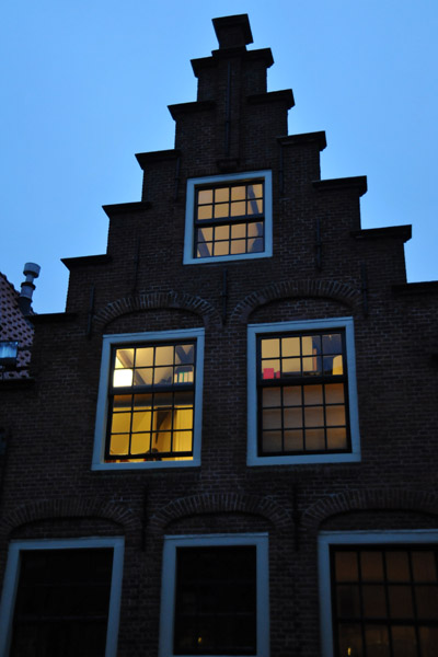 Lit windows of a Haarlem gable house