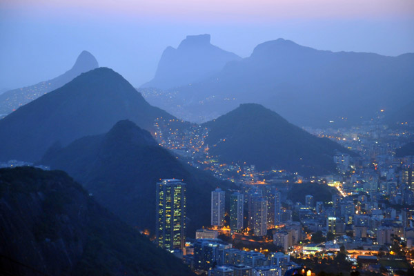 Favela Morro dos Cabritos lights up the mountain side overlooking Rio de Janeiro-Botafogo