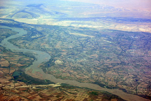 A canal joins the Amu Dar'ya River, Uzbekistan (N41 46.6/E060 33.2)