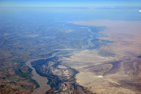The fertile Amu Dar'ya River valley soon gives way to desert heading north