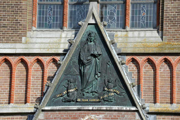 Bronze panel over the portal the the Sint Agathakerk, Lisse