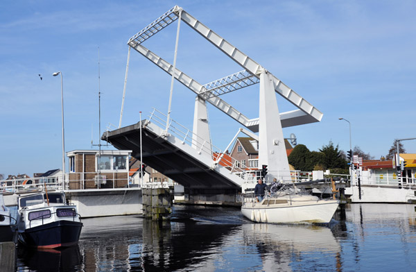 Lisse Bridge in the raised position to allow a mastless sailboat to pass