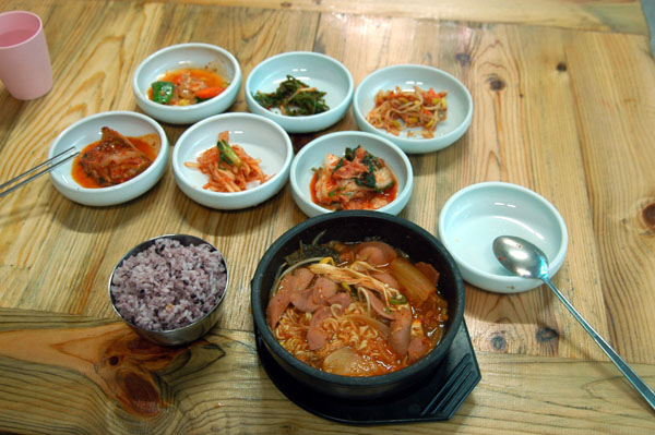 Korean noodle dish with the traditional side dishes
