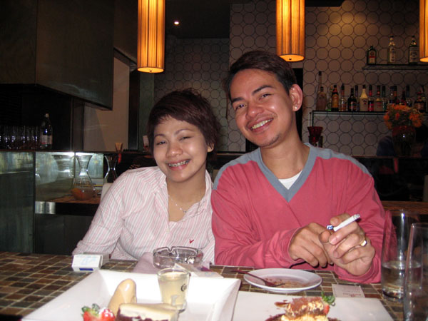 Romy and his Philipino friend out at her restaurant in Shanghai