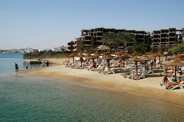 Main beach at the Hurghada Marriott with the incomplete hotel behind it