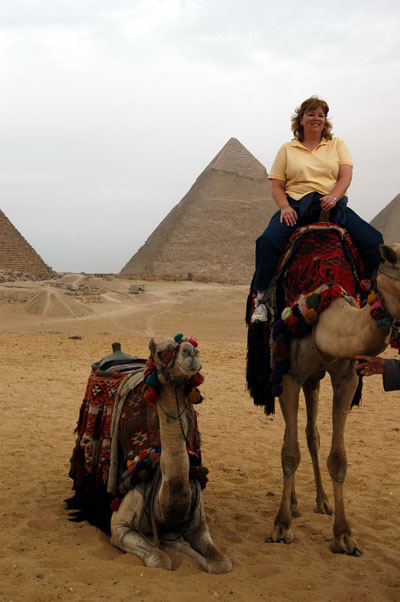 Debbie on a camel at the pyramids