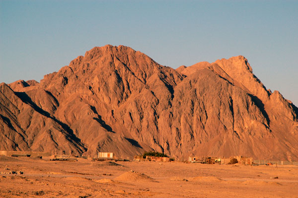 Early morning sun illuminates the coastal mountains