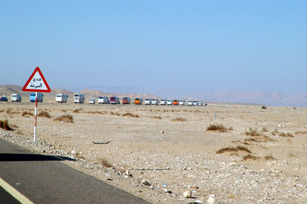 Convoy crossing a flat desert plain