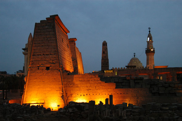 The impressive First Pylon illuminated at night, Luxor Temple