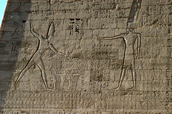 Ramses III smiting the Libyans and offering them to the gods