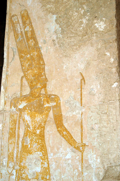 Amun carrying symbols of divinity, the scepter and the ankh