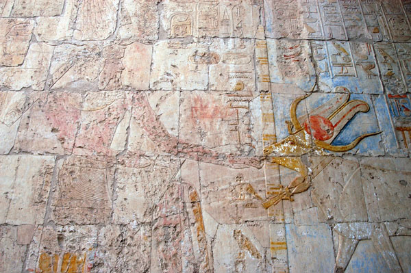 The goddess Hathor in the form of a cow licking the hand of Queen Hatshepsut