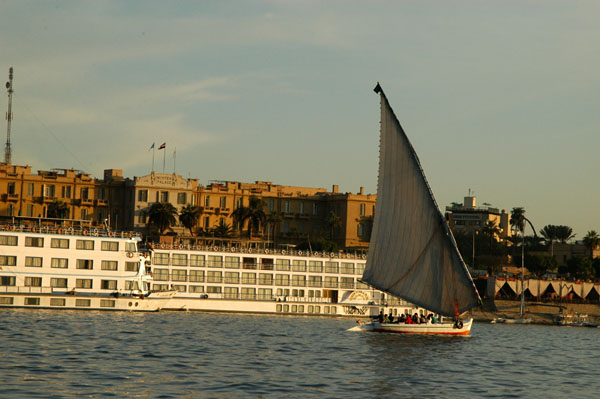 Felucca and cruise ship