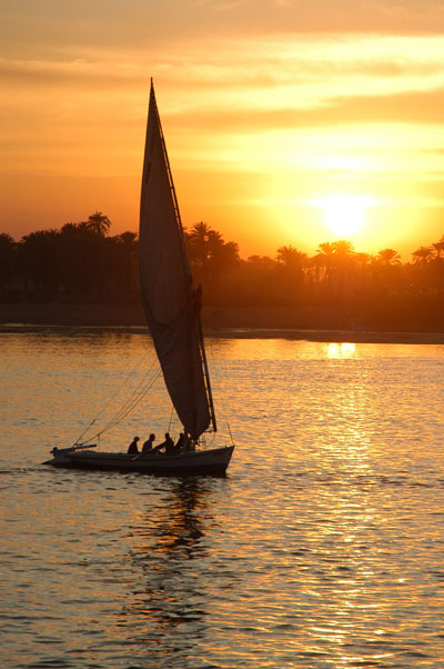 Felucca sailing at sunset