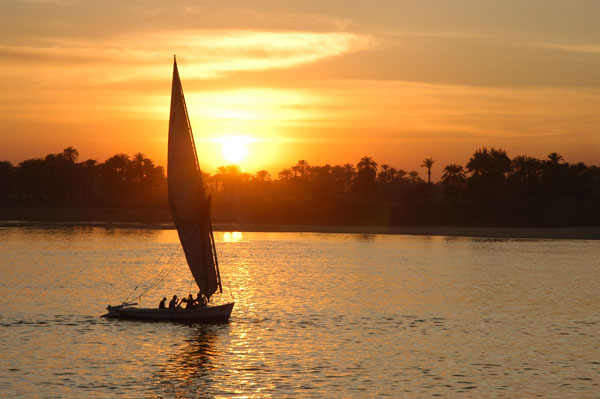 Felucca sailing at sunset