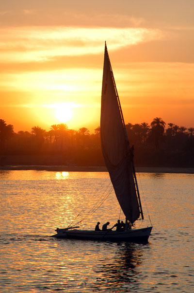 Felucca sailing at sunset