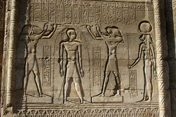 Horus and Thoth annointing Pharoah with the Key of Life in the presence of Sekhmet