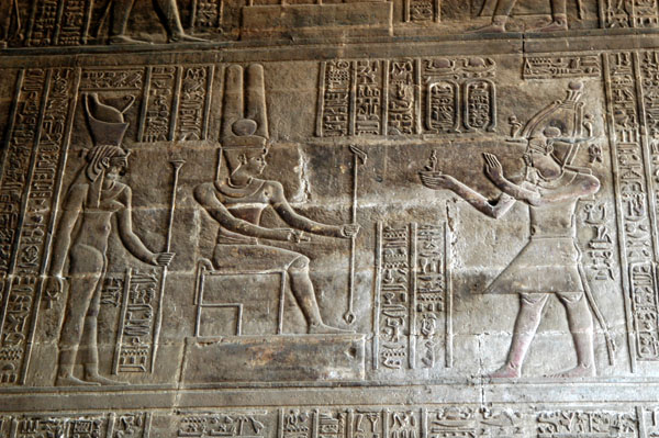 Amun seated, receiving offerings. Roman emperors are depicted as Pharoahs