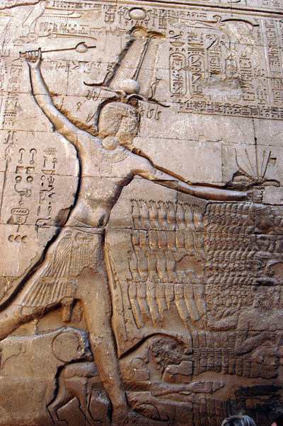 Pharoah smiting his enemies and feeding them to a lion