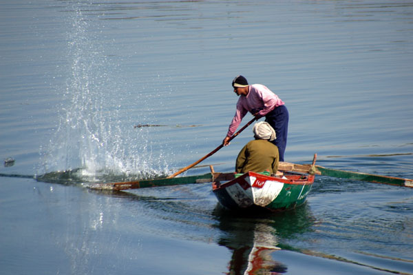 Fisherman slapping the water, Nile