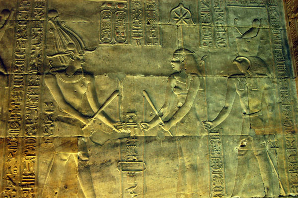 Pharoah with Seshet, Thoth's consort, goddess of writing and measurement, and Horus