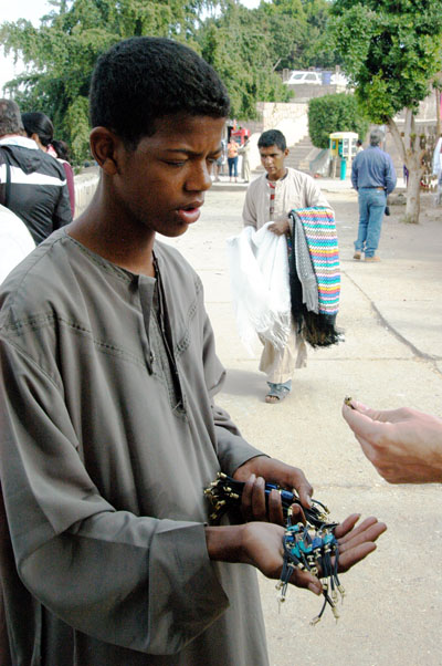 Boy selling scarab bracelets