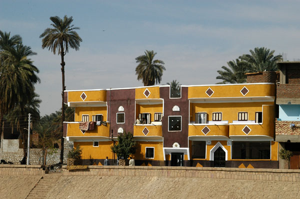 Yellow and brown painted houses just south of Kom Ombo