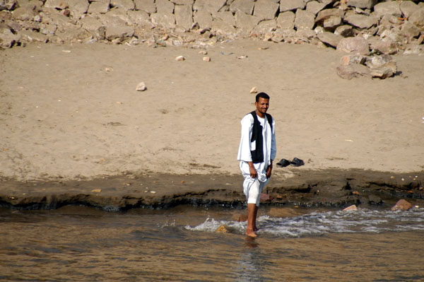 Wading in the Nile...the river seems cleaner this far south...but I have my doubts...there's a lot of Africa upstream