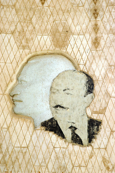 Sadat in mosaic with the profile of Nasser