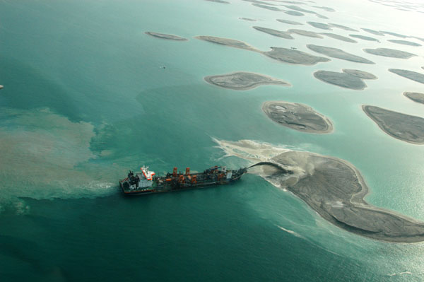 Ship spraying sand to build an island of The World