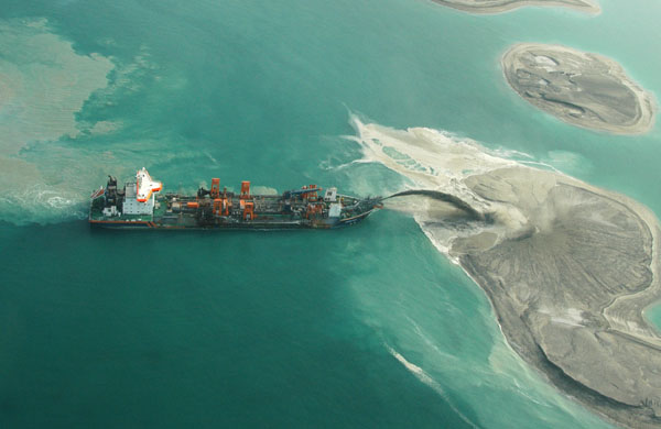 Ship spraying sand to build an island of The World