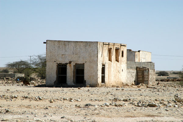 Abandoned traditional houses on the road from Al Zubara to Al Ruweis