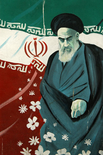 Khomeini with the Iranian flag on the former US Embassy wall, Tehran