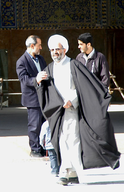 A regular imam (white turban)