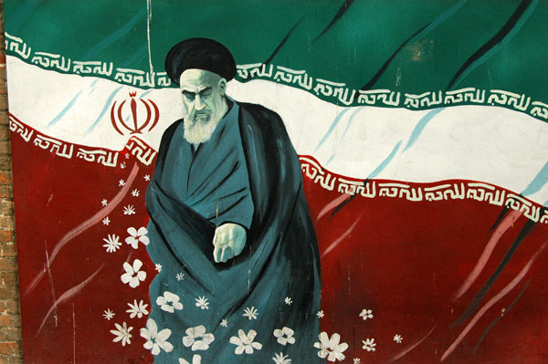 Khomeini with the Iranian flag on the wall of the former US Embassy, Tehran