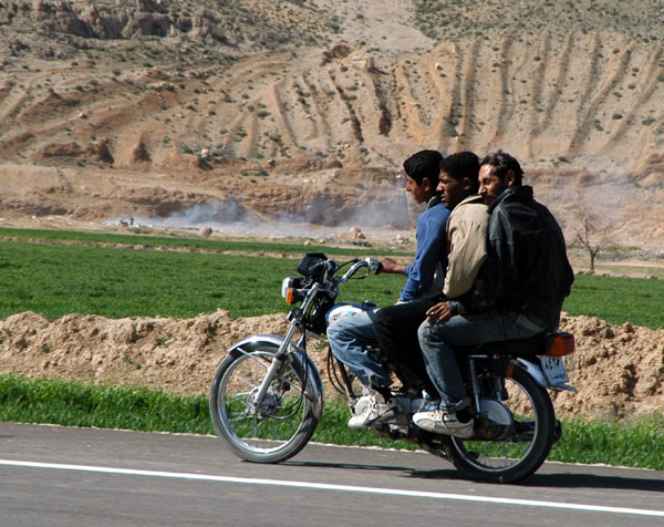 Three guys on a motorbike
