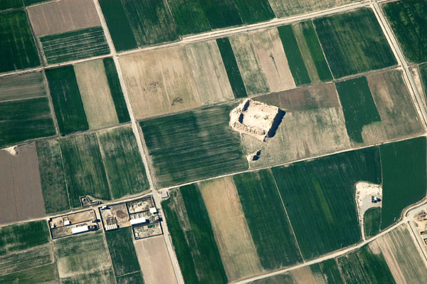 Old caravanserai now surrounded by farms, Iran