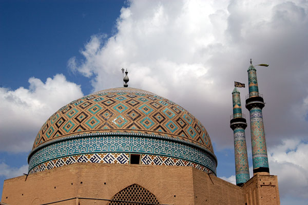 Dome and minarets from an alley outside the bazaar to the south of the Jameh Mosque