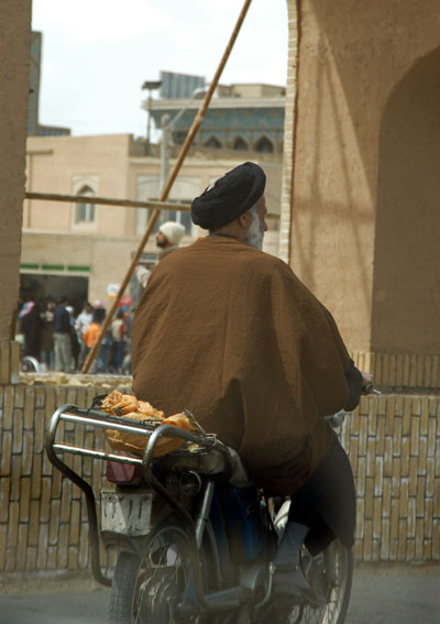 Mullah on a moped