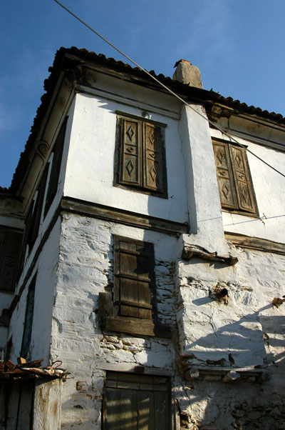 White-washed stone and stucco house