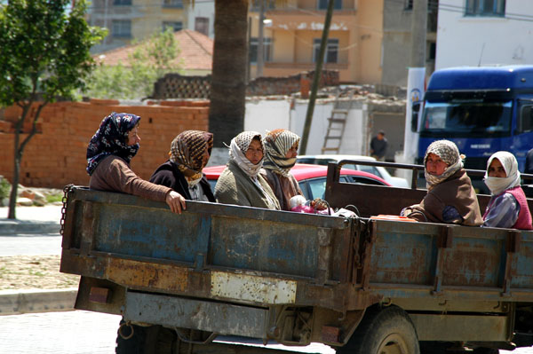 Six peasant women in the back of a truck driving through Seluk