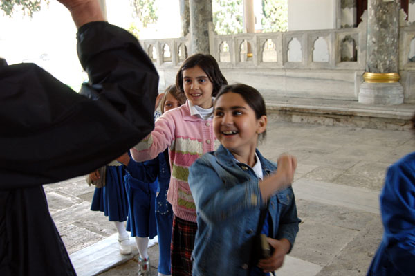 Dad greeting Turkish schoolgirls