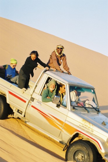 Italian Tourist Group iwith Solomon in Badwin scort crossing at Empty Quarter Desert