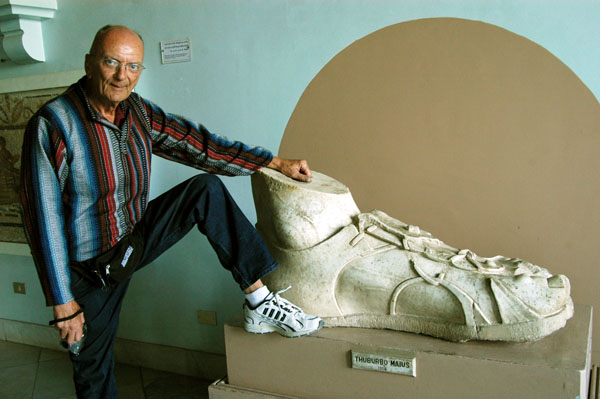 Fragment of a colossal statue of Jupiter from the Capitol of Thuburbo Majus, with dad showing the scale (7.5m tall)