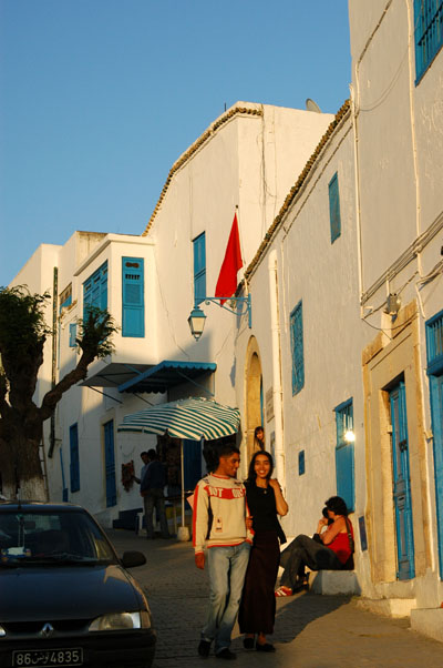 Tunisian couple strolling down main street