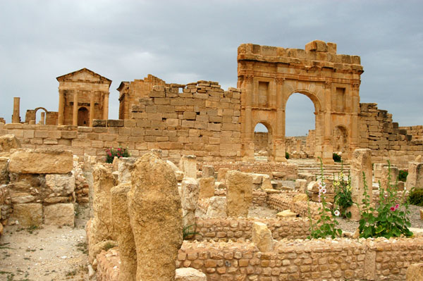 Arch of Antonius Pius and the Temple of Minerva across ruins of the market